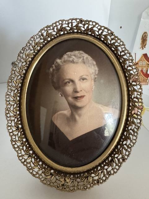 Margaret Beatrice Eaken Bell — hand-tinted studio portrait in a gilt filigree oval frame, about the 1950s