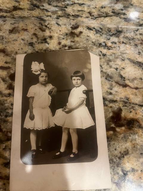 Helen May Knott as a girl, with a friend named Grace