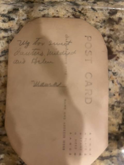 The back of the postcard, written by their mother